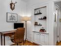 Bright office with hardwood floors, built-in shelves, and a vintage desk setup at 1111 Briarcliff Ne Pl # 2, Atlanta, GA 30306