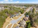 Beautiful aerial view of a neighborhood featuring well-maintained homes and lush greenery at 1439 Mill Pointe Ct, Lawrenceville, GA 30043