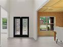 Elegant foyer with decorative glass double doors and views into the dining room and front living room at 1439 Mill Pointe Ct, Lawrenceville, GA 30043
