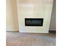 Modern electric fireplace adds a cozy touch to this carpeted living room at 2958 Parc Lorraine, Lithonia, GA 30038