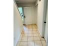 Hallway features tile floors leading into the home with an exterior glass door at 207 Tiburon Dr, Stonecrest, GA 30038
