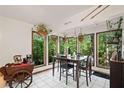 Bright dining area with large windows offering scenic views of the surrounding nature at 613 Rock Springs Pass, Dallas, GA 30157