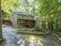 Inviting home with a covered front porch and nicely landscaped yard at 613 Rock Springs Pass, Dallas, GA 30157