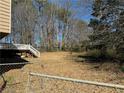 Expansive, overgrown, and fenced in back yard at 1125 Durrell St, Austell, GA 30106