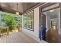 Inviting front porch view, showing the entrance and interior of this gorgeous home at 1158 Welch Sw St, Atlanta, GA 30310