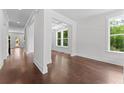 Bright interior view featuring beautiful hardwood floors and modern, neutral paint at 1158 Welch Sw St, Atlanta, GA 30310
