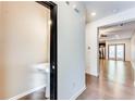Inviting entryway with hardwood floors, a pedestal sink, and access to the living spaces at 992 Belfry Ter, Fairburn, GA 30213