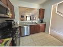 Open-concept kitchen boasts granite countertops, stainless steel appliances, and seamless flow to living areas at 585 Mcwilliams Se Rd # 2602, Atlanta, GA 30315
