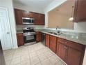 Well-lit kitchen featuring granite countertops, stainless steel appliances, and ample cabinet space at 585 Mcwilliams Se Rd # 2602, Atlanta, GA 30315