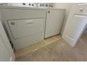Convenient laundry area featuring a white washer and dryer with door to another room at 585 Mcwilliams Se Rd # 2602, Atlanta, GA 30315
