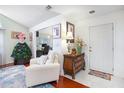 Bright entryway with white trim, hardwood floors, and stylish furnishings at 1203 Cascade Park Sw Dr, Atlanta, GA 30331