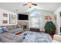 Inviting living room with a stone fireplace, large windows, and comfortable seating at 1203 Cascade Park Sw Dr, Atlanta, GA 30331
