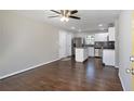 Open floorplan featuring a kitchen with stainless steel appliances and hardwood flooring throughout at 1798 Giben Rd, Atlanta, GA 30315