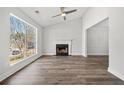 Bright living room featuring hardwood floors, fireplace, large window and plenty of natural light at 2111 Glenwood Downs Dr, Decatur, GA 30035