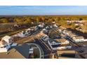 Aerial view of a neighborhood with tree-lined streets and manicured lawns at 51 Hydrangea Unit 74 Way, Auburn, GA 30011