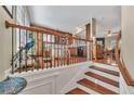 Open-concept staircase leading to a kitchen and dining area at 113 Brianna Way, Woodstock, GA 30188