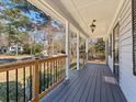 The spacious covered porch offers a pleasant spot for relaxation at 150 Forest Ridge Ct, Lawrenceville, GA 30046