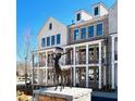 Elegant townhome exterior with classic architectural details and a stately statue at 2257 Addington Way # 56, Atlanta, GA 30319