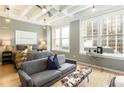 Bright bedroom with large windows, a comfortable seating area, and minimalist decor at 32 Peachtree Nw St # 1105, Atlanta, GA 30303
