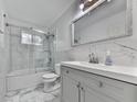 Modern bathroom with marble tile, sleek vanity, and glass-enclosed shower offering a luxurious experience at 6700 Roswell Rd # 24E, Atlanta, GA 30328