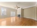 Spacious living room featuring a fireplace, hardwood floors, and ample natural light at 1211 Comet View Se Trl, Smyrna, GA 30082