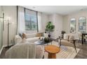 Cozy living area with hardwood floors, white furniture, and plenty of natural light at 2270 Jamin Bnd # 12, Lithonia, GA 30058