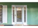 Elegant front door featuring decorative glass panels and a white frame at 2330 Bonnybrook Way, East Point, GA 30344