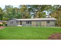 Beautiful house with an expansive lawn, decorative trellises, and manicured landscaping at 642 Austin Se Dr, Smyrna, GA 30082