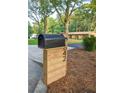 Close-up of a classic mailbox with the house number displayed on a wooden post at 642 Austin Se Dr, Smyrna, GA 30082