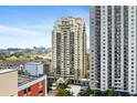 An exterior view shows the high-rise buildings and surrounding city skyline at 795 Hammond Dr # 801, Atlanta, GA 30328