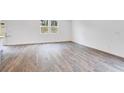 Spacious and inviting living room featuring hardwood floors and ample natural light at 203 Groveton Ct, Euharlee, GA 30145