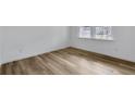 Bright bedroom features durable flooring and a large window, offering plenty of natural light at 362 Rock View Ln, Covington, GA 30016