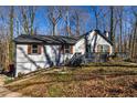 Well-maintained one-story home with a cozy front porch and nice landscaping at 387 Pine Trail, Canton, GA 30115
