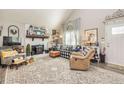 Bright living room with a vaulted ceiling, stone fireplace, and plenty of seating at 387 Pine Trail, Canton, GA 30115