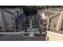A beautifully landscaped walkway divides townhomes and is perfect for walking to a community park at 315 Chiswick Cir # 38, Alpharetta, GA 30009