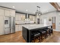Modern kitchen with stainless steel appliances, granite countertops, and a large center island at 3564 Suwanee Creek Rd, Suwanee, GA 30024