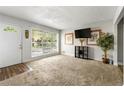 Inviting living room with large window, plush carpeting, and neutral paint at 1082 Green Valley Nw Dr, Conyers, GA 30012