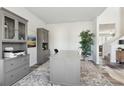 Inviting home office with built-in storage, a large desk, and stylish decor at 117 Longhorn Way, Auburn, GA 30102