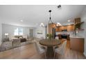 Open-concept living space with a dining area and modern fixtures at 3185 Delhi Dr, Powder Springs, GA 30127