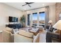 Bright living room with neutral furniture, hardwood floors, and large windows offering a scenic view at 962 Bibbs Circle # 5, Atlanta, GA 30318