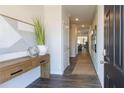 Inviting foyer showcasing modern interiors with stylish console table, decor and a view of the living spaces at 2402 Bayberry St, Acworth, GA 30101