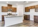 Well-equipped kitchen with granite countertops, stainless steel appliances, and ample cabinet space at 204 Groveton Ct, Euharlee, GA 30145