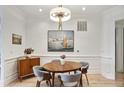 Dining room features a round wooden table, seating for four and detailed trim work at 625 Piedmont Ne Ave # 3028, Atlanta, GA 30308