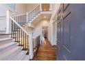 Welcoming entryway with hardwood floors and an elegant staircase at 1074 Fairway Ne Ests, Atlanta, GA 30319