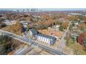 Aerial view of townhomes with a city skyline in the background at 310 Mcdonough Se Blvd # 101, Atlanta, GA 30315