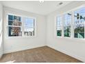 Bright bedroom with neutral carpet, large windows, and fresh paint creating an airy atmosphere at 310 Mcdonough Se Blvd # 101, Atlanta, GA 30315