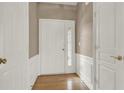 Foyer features hardwood floors and white trim at 916 Santa Anita Dr, Woodstock, GA 30189