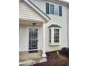 Townhouse front door with security gate, bay window, white columns, and siding at 1625 Conley Rd # 171, Conley, GA 30288