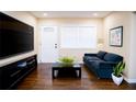 Cozy living room with modern decor, hardwood floors, and plenty of natural light at 1975 Glenmar Dr, Decatur, GA 30032