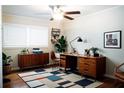 Stylish home office featuring modern furnishings, wood floors, and ample workspace at 1975 Glenmar Dr, Decatur, GA 30032